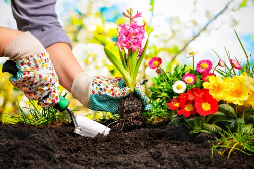 Professional gardeners in West Heath following safety procedures